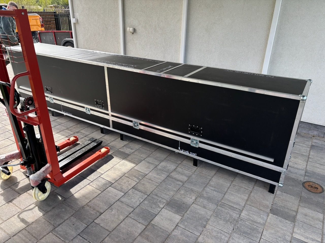 Case ready to be moved by pallet truck
